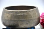 Collected antique Mani singing bowl showing natural patina, aged surface marks, and authentic texture
