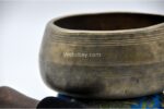 Collected antique Mani singing bowl showing natural patina, aged surface marks, and authentic texture