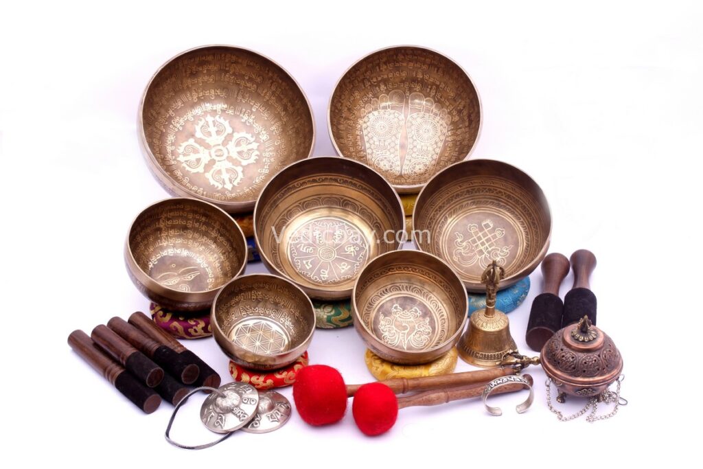 Professionally tuned 7 chakra Tibetan singing bowl set with mantra etching, handmade in Nepal with bell, tingsa, and accessories